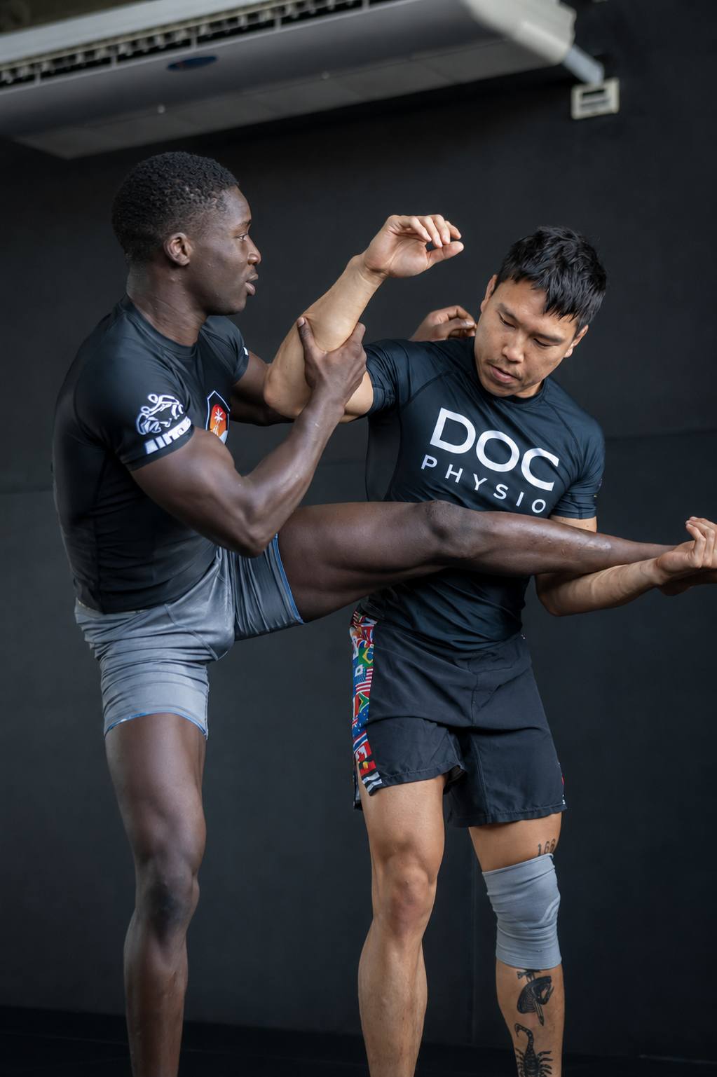 Damien Tse working with an athlete